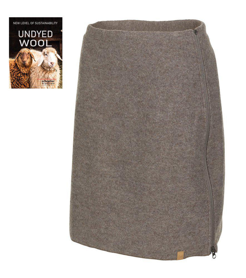  Rak kjol i naturligt brunmelerad ull med diskret dragkedja i sidan och litet tygmärke nertill, mot vit bakgrund och "Undyed Wool"-skylt.